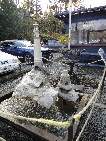 Sculpture of a lighthouse on the waterfront